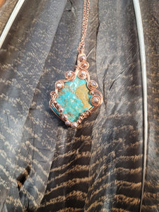 Turquoise wrapped in copper